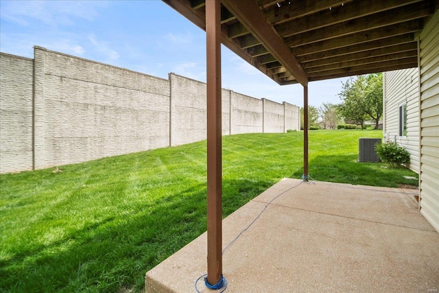 view of yard with central air condition unit, a patio area, and fence