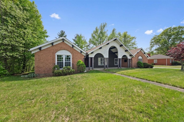 single story home with a front lawn and brick siding