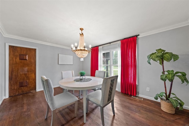 dining space with ornamental molding, a notable chandelier, and visible vents