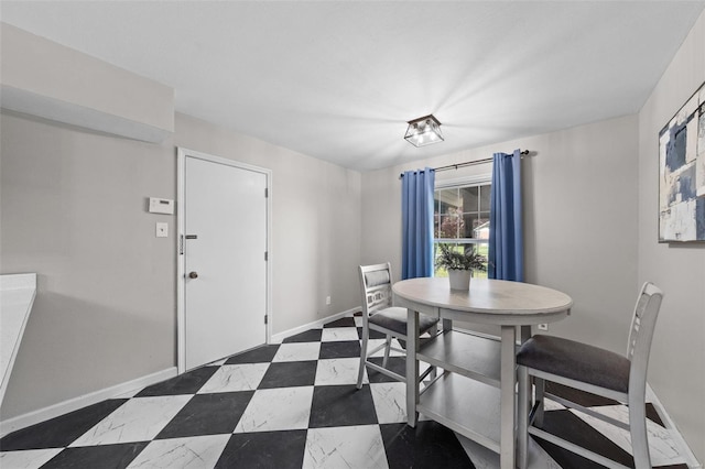dining room with baseboards