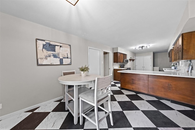dining area featuring baseboards