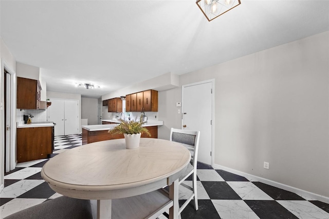 dining room with baseboards