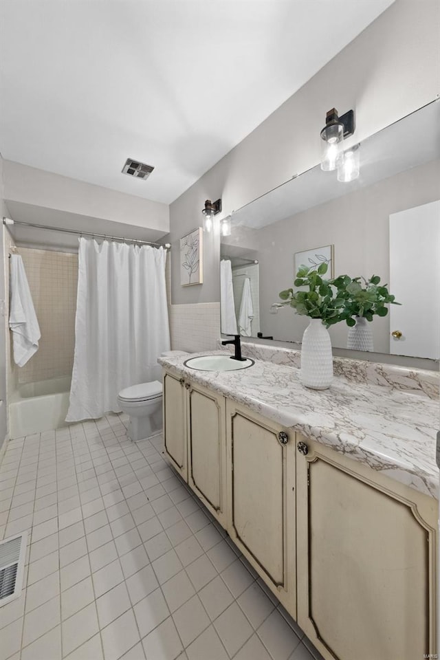 full bath with toilet, tile patterned flooring, visible vents, and vanity