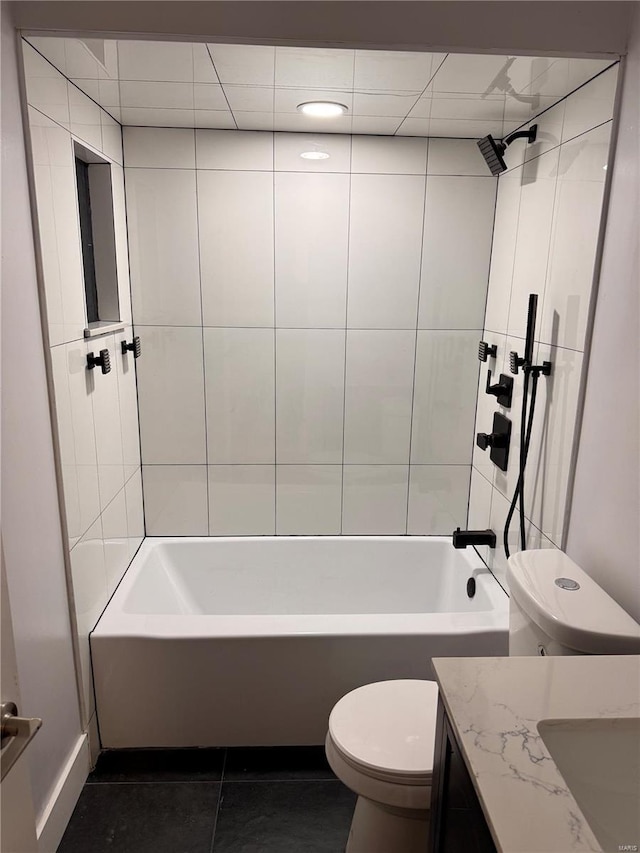 bathroom with toilet, tile patterned flooring,  shower combination, and vanity
