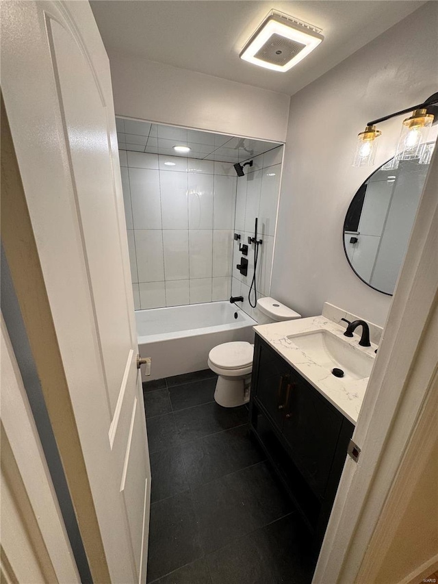 bathroom with tile patterned floors, toilet, shower / bath combination, and vanity