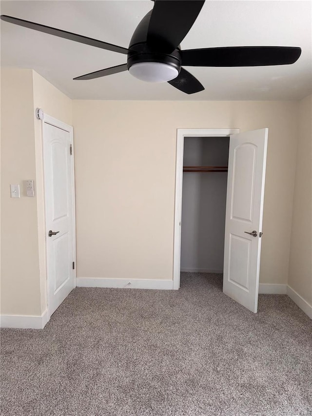 unfurnished bedroom featuring a closet, baseboards, a ceiling fan, and light carpet