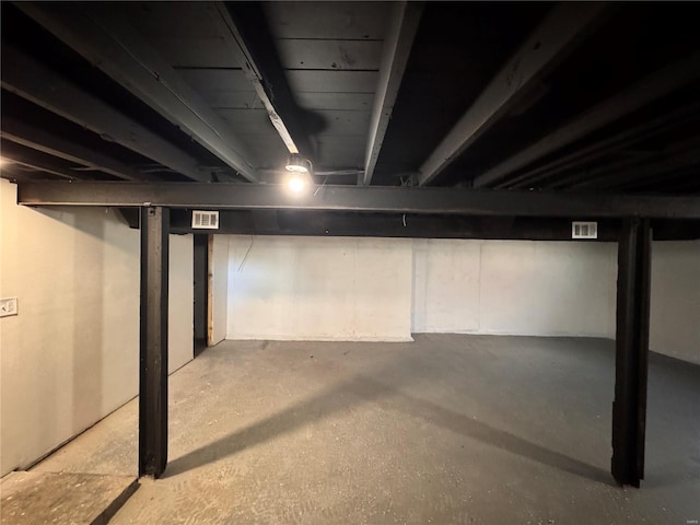 unfinished basement featuring visible vents