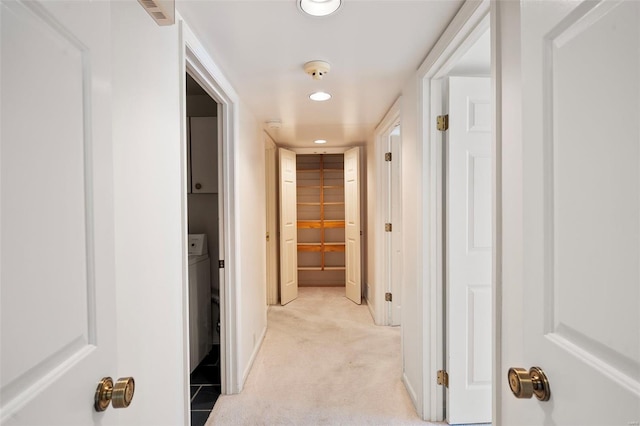 corridor with light colored carpet, recessed lighting, and baseboards
