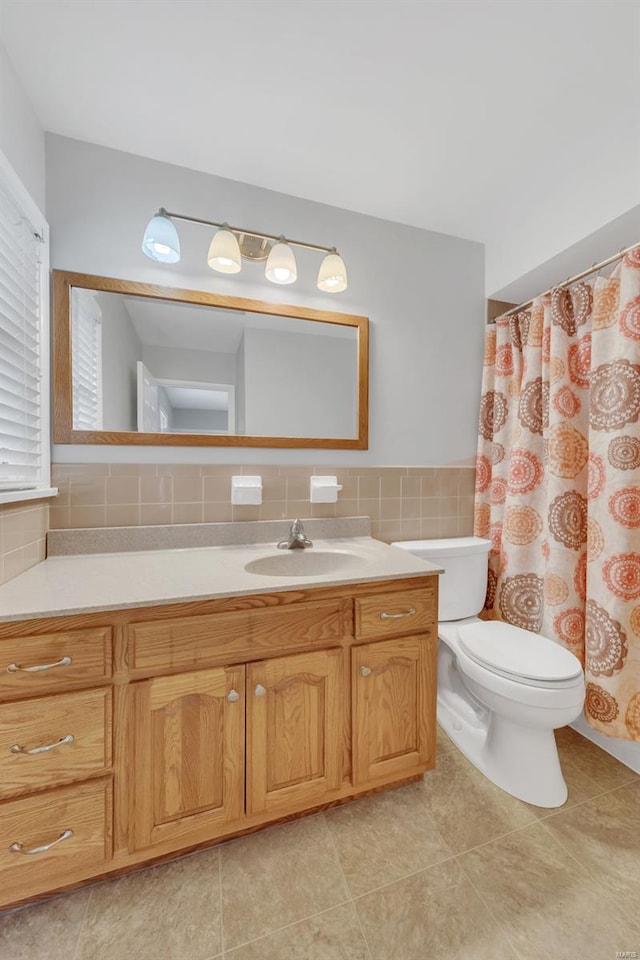 bathroom with tile patterned floors, toilet, and vanity