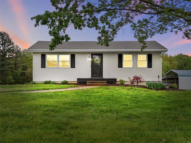 view of front of property with a yard
