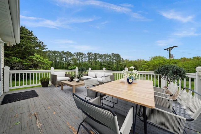 wooden deck featuring outdoor dining area