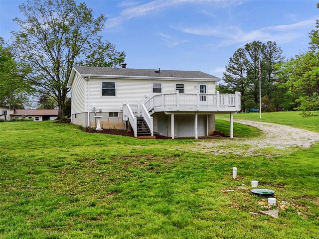 back of house featuring stairway, a yard, a wooden deck, and dirt driveway