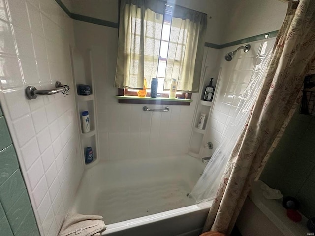 bathroom featuring shower / bath combo with shower curtain