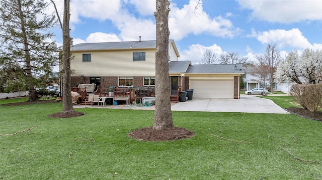 rear view of house featuring a garage, a lawn, concrete driveway, and brick siding