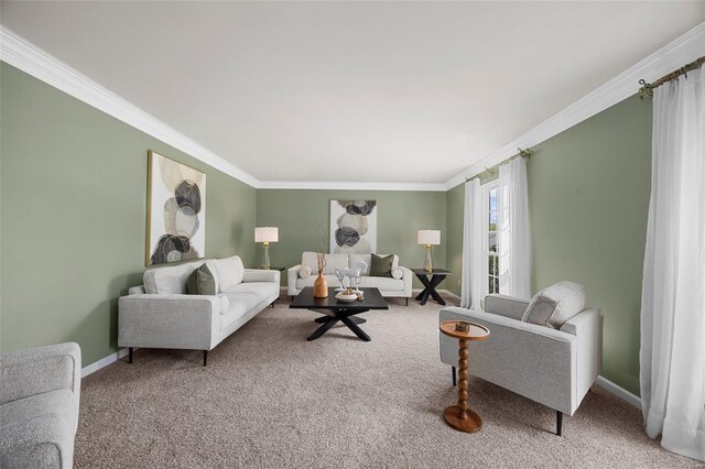 carpeted living area featuring baseboards and ornamental molding