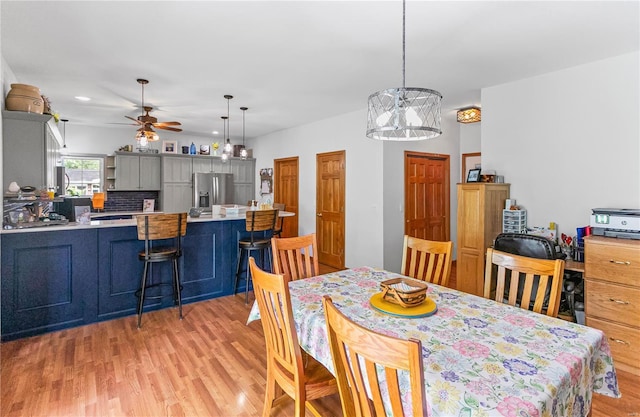dining space with recessed lighting, ceiling fan, and light wood-style flooring