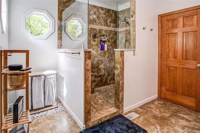 bathroom with baseboards and a walk in shower