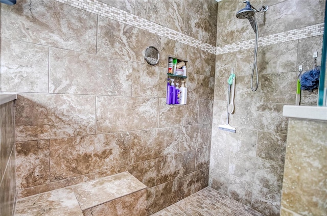 full bathroom with tiled shower
