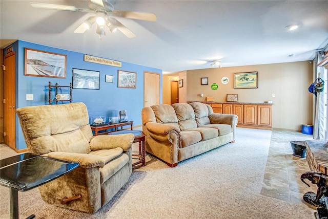 living area featuring ceiling fan and light carpet