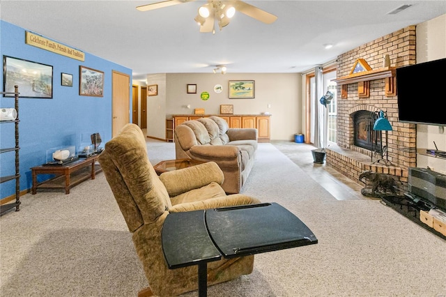 carpeted living area with visible vents, ceiling fan, and a fireplace