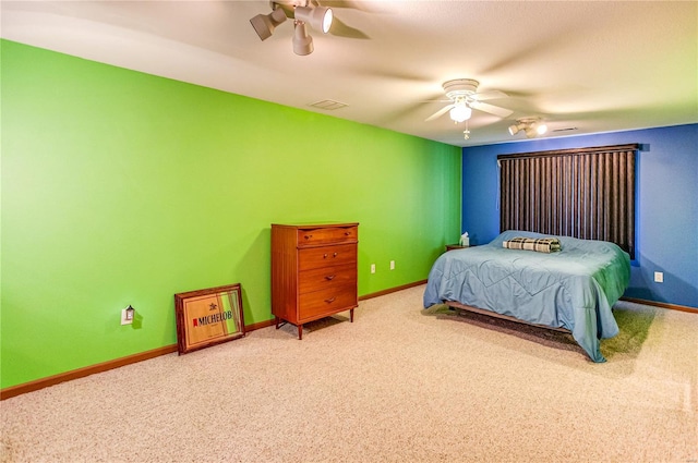 bedroom featuring a ceiling fan, carpet flooring, baseboards, and visible vents