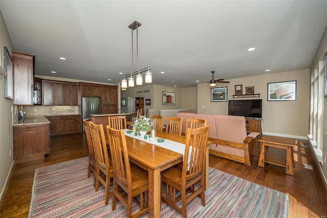 dining room featuring recessed lighting, a ceiling fan, dark wood finished floors, and baseboards