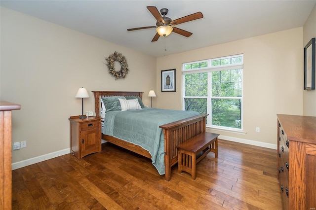 bedroom featuring baseboards, ceiling fan, and hardwood / wood-style floors