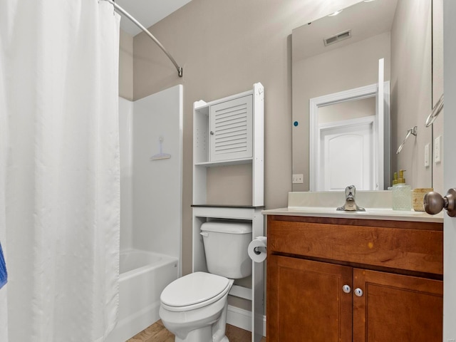 bathroom featuring visible vents, shower / bath combo with shower curtain, toilet, and vanity