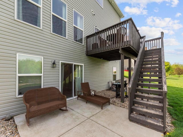 view of patio / terrace with grilling area, a deck, and stairs