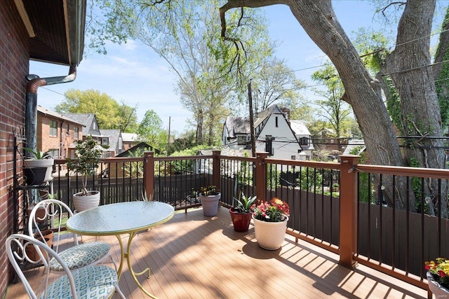 wooden deck featuring a residential view