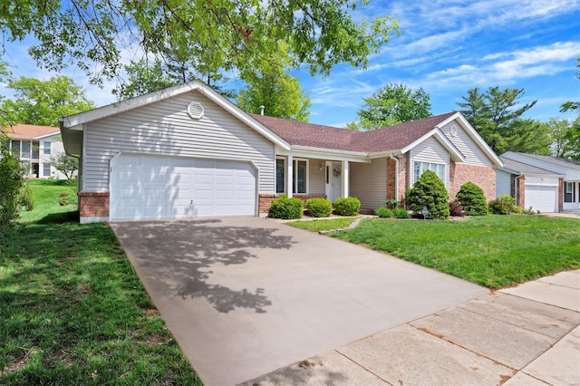 single story home featuring brick siding, a front lawn, an attached garage, and concrete driveway