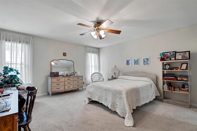 bedroom featuring baseboards, carpet, and a ceiling fan