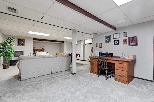 home office with visible vents, a drop ceiling, and carpet