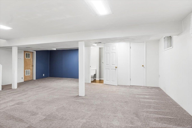 finished basement with carpet and visible vents