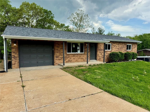 ranch-style home featuring a garage, brick siding, a front lawn, concrete driveway, and a shingled roof