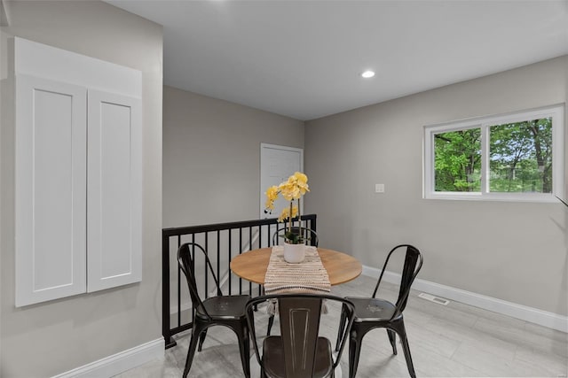 dining area with recessed lighting and baseboards