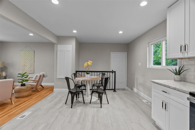 dining space featuring recessed lighting, baseboards, and visible vents