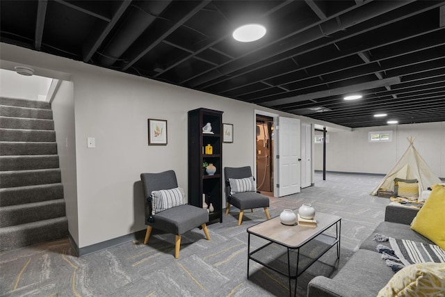 living area with carpet flooring and stairway