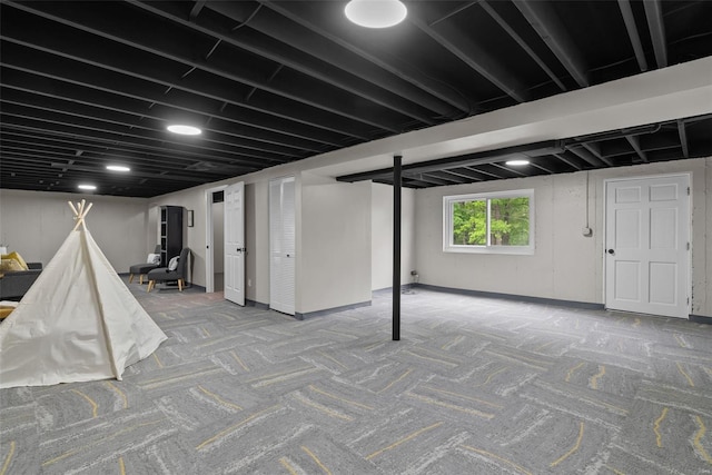 basement featuring carpet flooring