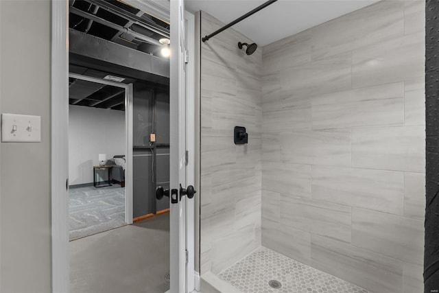 full bath featuring a tile shower