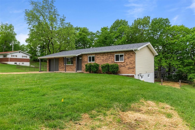 single story home featuring fence, a front lawn, and a garage
