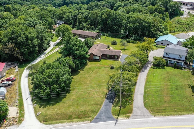 aerial view featuring a wooded view