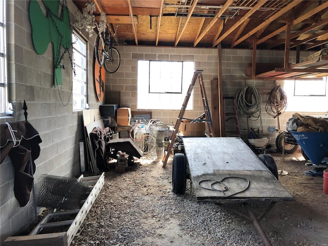 interior space with concrete block wall