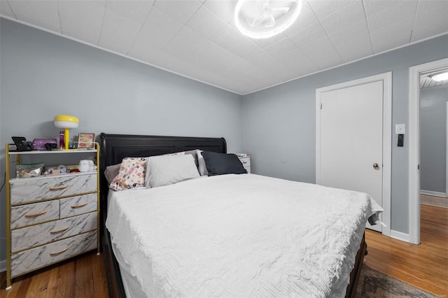 bedroom featuring wood finished floors