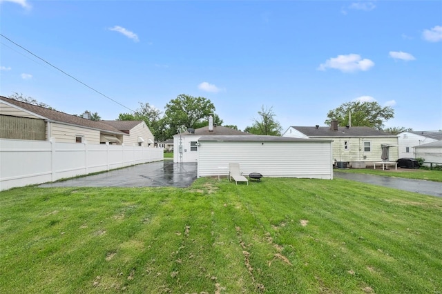 view of yard with fence and a patio area