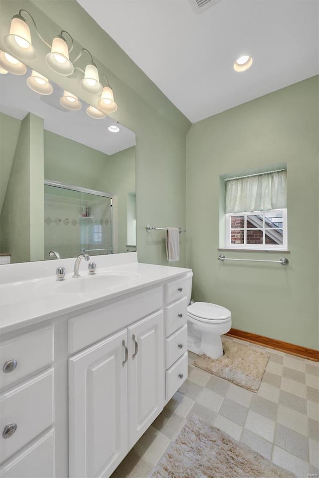 full bathroom with a stall shower, vanity, tile patterned floors, toilet, and recessed lighting