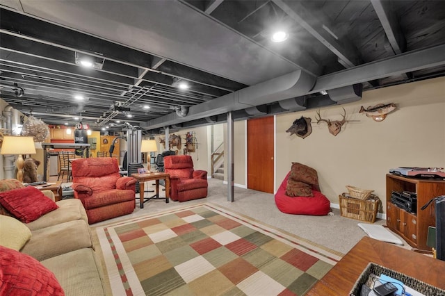 finished below grade area with carpet floors, baseboards, and stairs