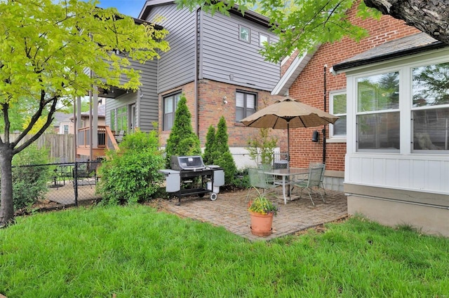 view of yard featuring fence and a patio
