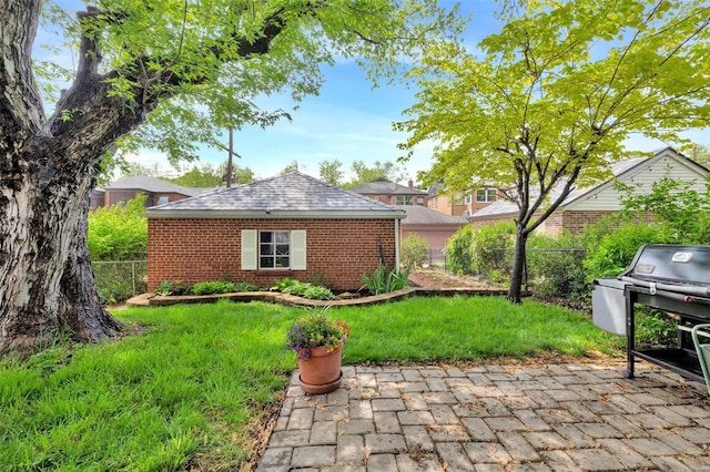 exterior space with a patio and a fenced backyard