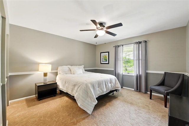 bedroom with carpet floors, baseboards, and a ceiling fan